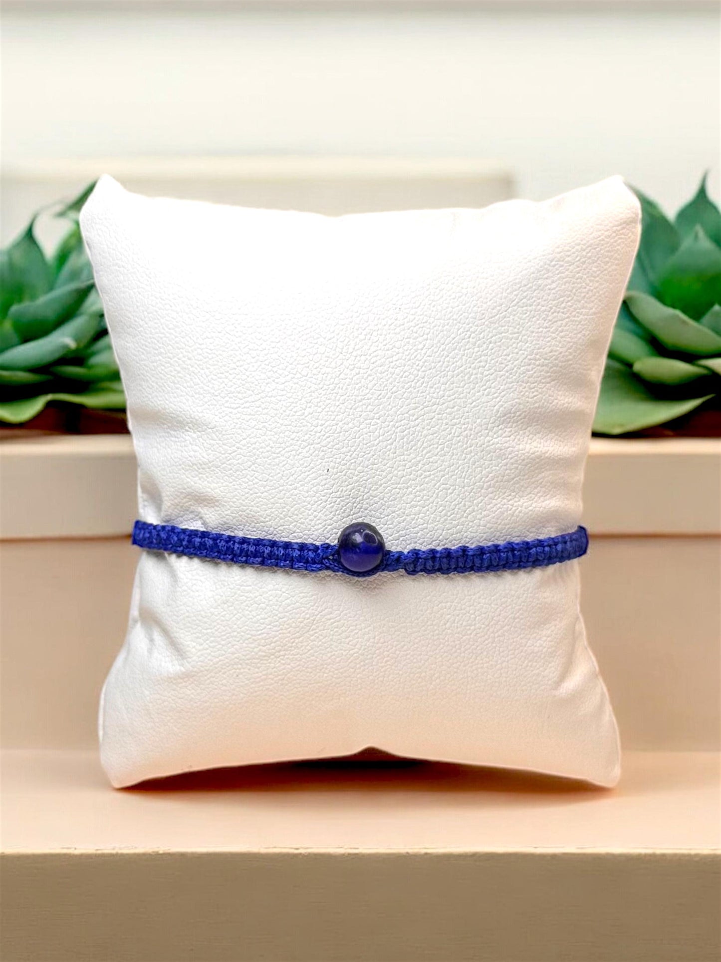 Blue macrame friendship bracelet with gemstone