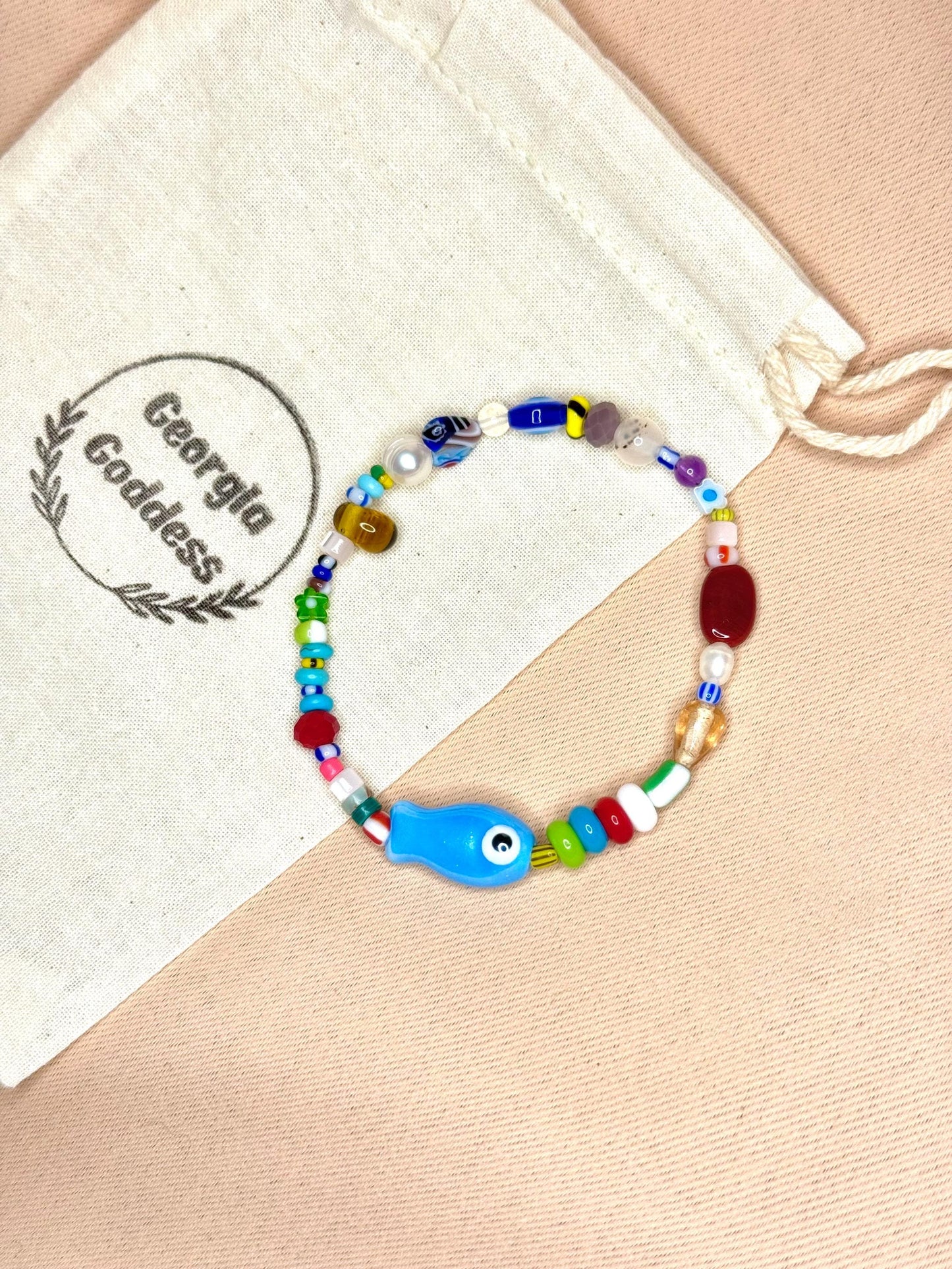 Evil Eye Fish Charm Bracelet: Freshwater Pearls & Glass Beads
