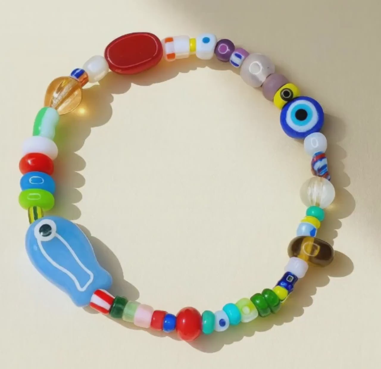Evil Eye Fish Charm Bracelet: Freshwater Pearls & Glass Beads